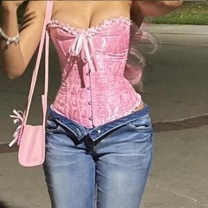 Pink corset with lace up back and bow detail,wore once for photos